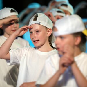 students in white hats and t shirts