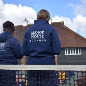 adults in manor house uniform