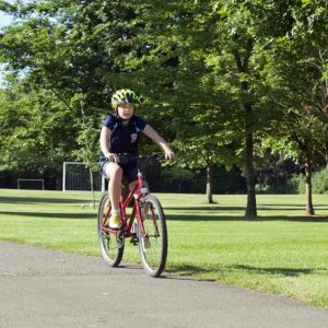 student riding a bike